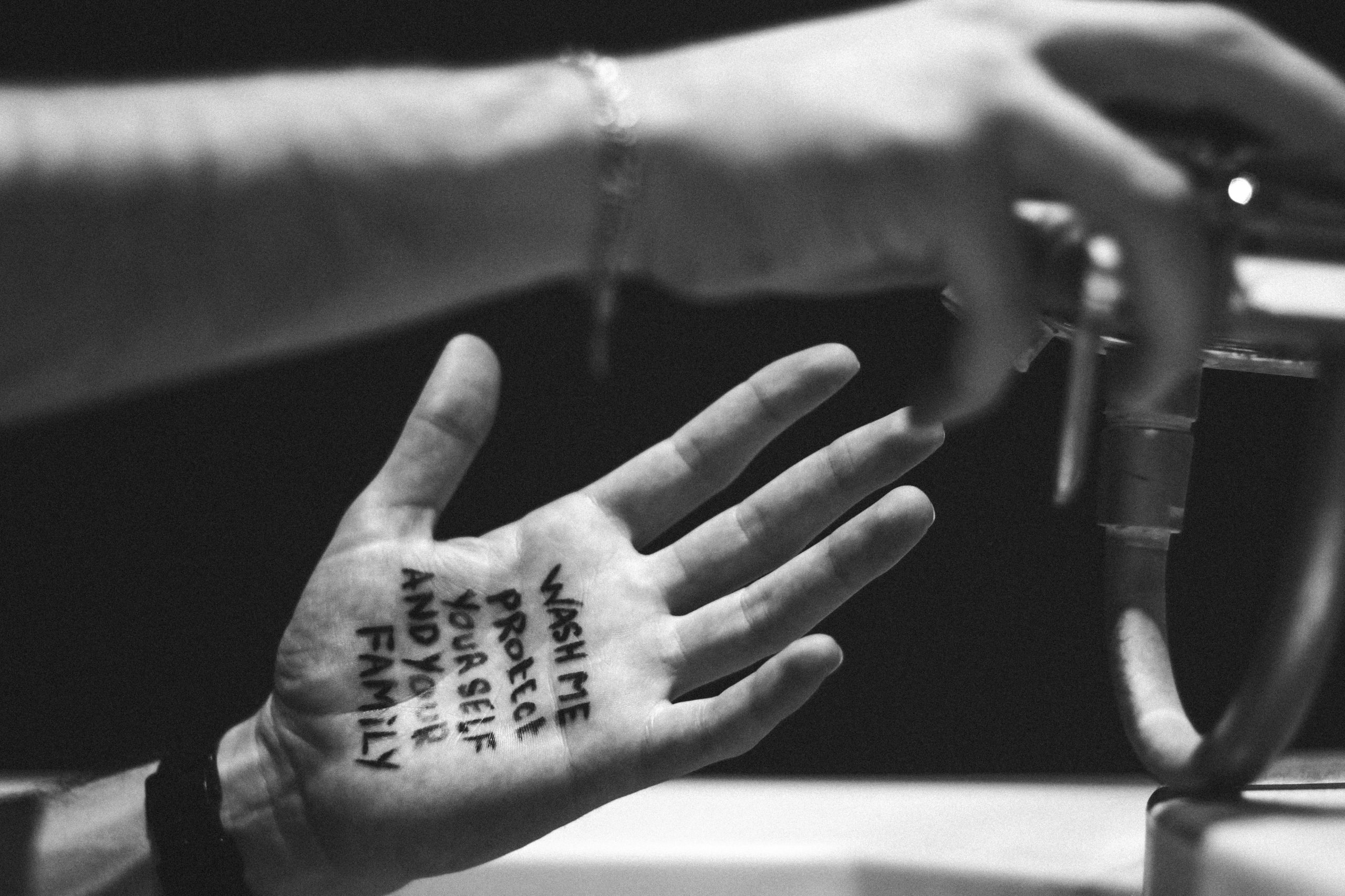 Hand washing with note "wash me protect yourself and your family"