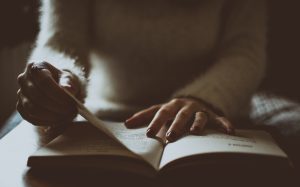 Person reading from a book