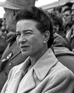 black and white photograph of Simone de Beauvoir in a crowd of spectators