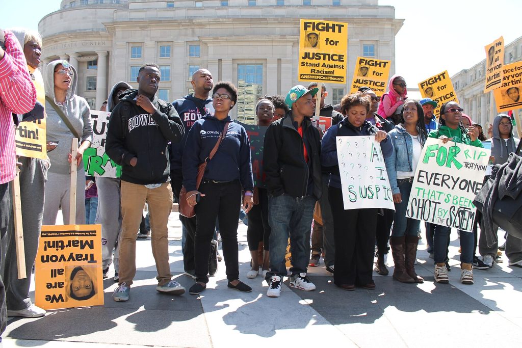 Demonstrators advocating for racial justice and systemic change.