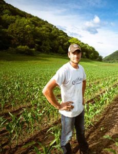 Man standing in a field of corn