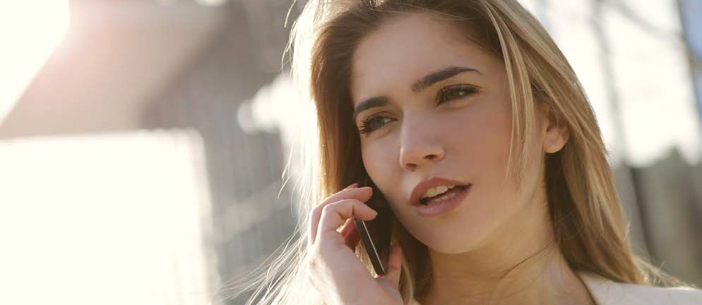 zoomed in image of a woman on the phone