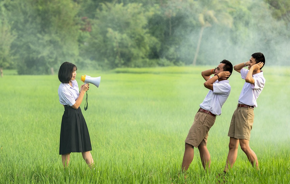 Woman using a megaphone to speak.