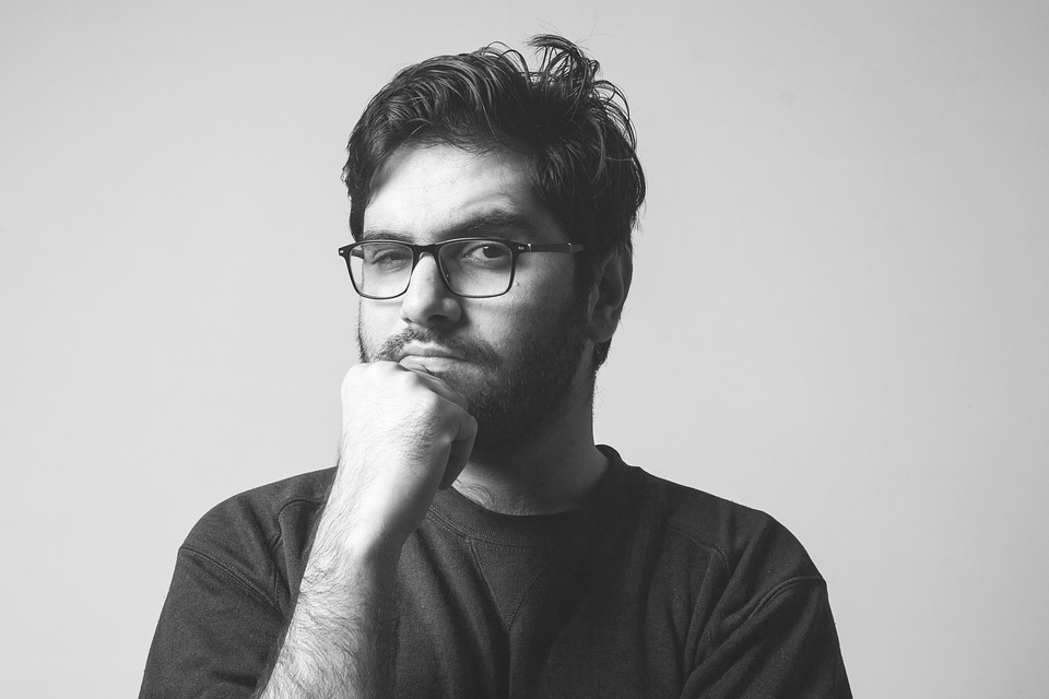 Man in a thinking pose.