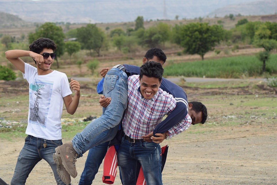 Small group of men fighting.