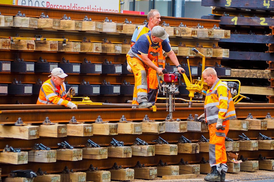 Four constructions workers work together on a shift.