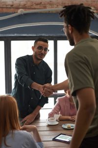 An image of two men shaking hands.